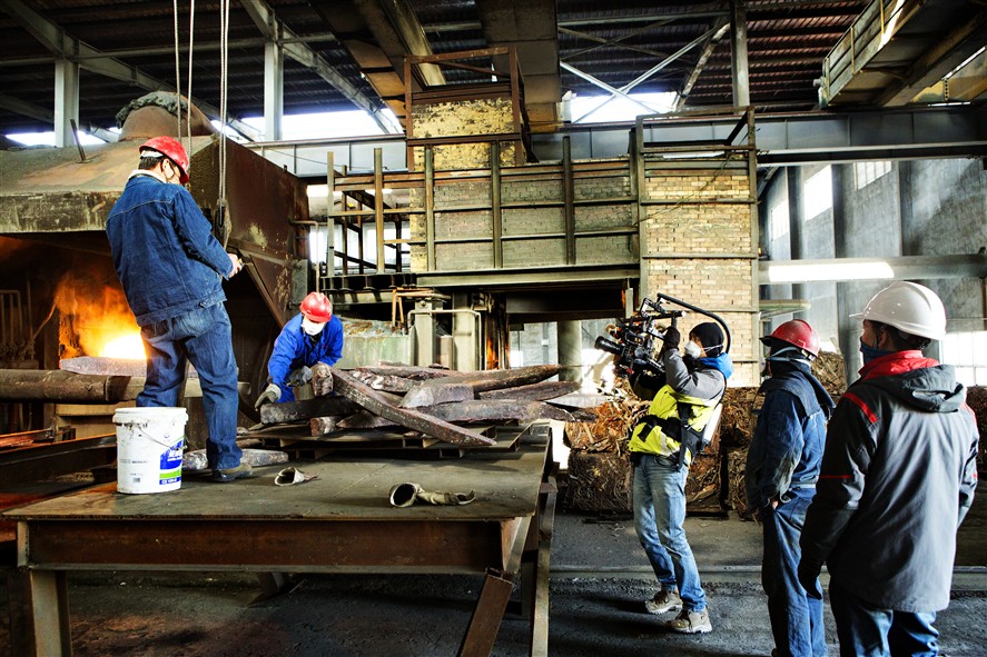 Dongguan crew members discussing a shoot plan